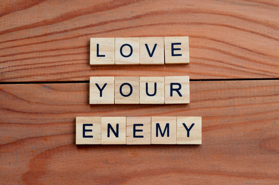 love your enemy text on wooden square, religion quotes