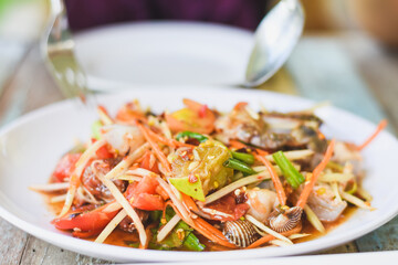 Close-up of Asian woman eating papaya salad