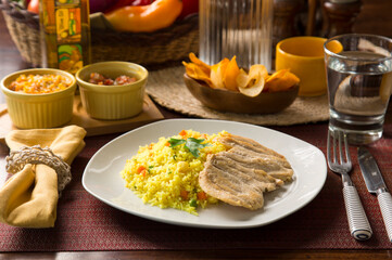 Light chicken filet and yellow rice Peruvian gourmet restaurant food