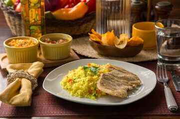 Light chicken filet and yellow rice Peruvian gourmet restaurant food