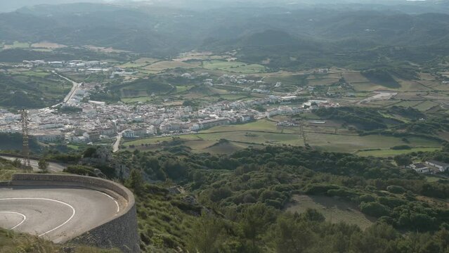 Car on winding road Menorca from mountain top of Mirador Cim del Toro, Es Mercadal, Menorca, Balearic Islands