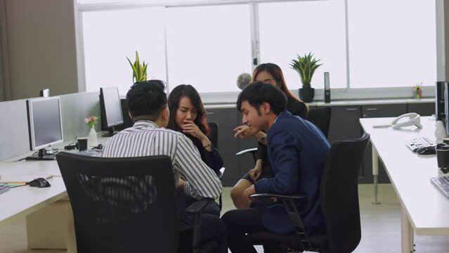 Employees gather to gossip. The boss came to warn employees