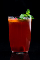 Fruit hot tea with the addition of oranges and raspberries in a glass cups Healthy hot drink