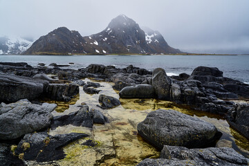 Views of snow-covered mountains in the Norwegian fjord of Lofoten