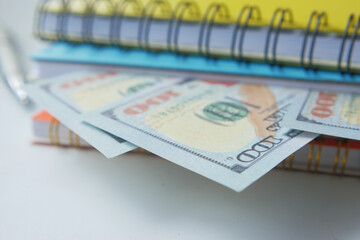 close up of dollar cash in a notepad 