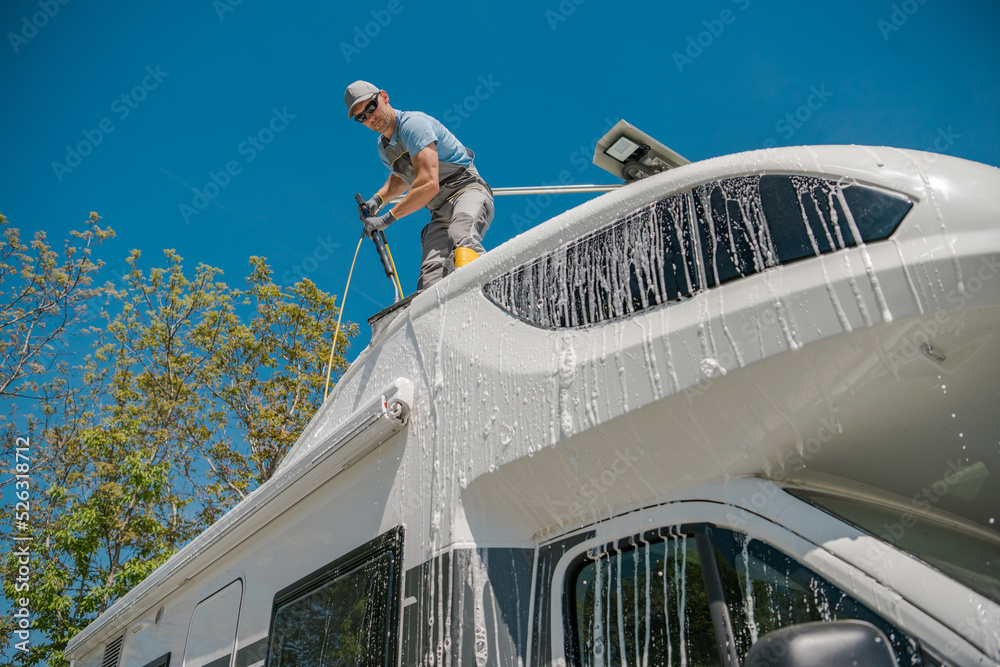 Canvas Prints man washing his rv with a car wash brush