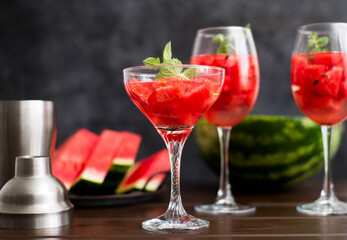 watermelon alcoholik or non- alcoholic cocktail with mint on dark background