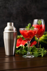 watermelon alcoholik or non- alcoholic cocktail with mint on dark background