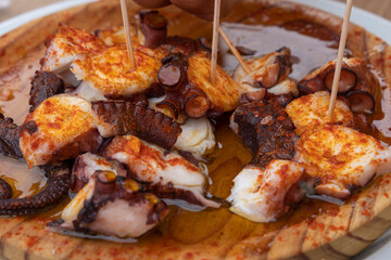 Ration of pulpo a feira, typical Galician recipe for cooking octopus.