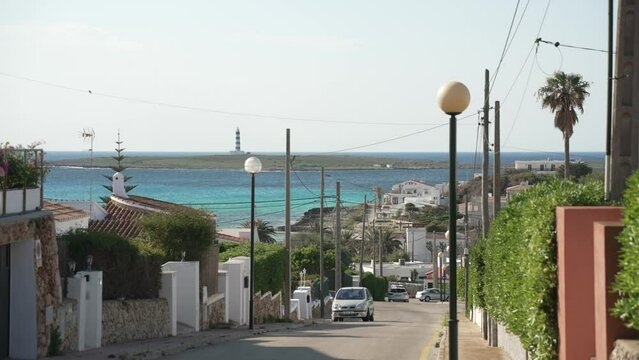 Town and lighthouse from elevated position in Punta Prima, Punta Prima, Menorca, Balearic Islands