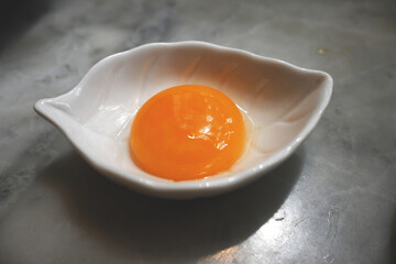 fresh raw organic free range egg yolk  - obrazy, fototapety, plakaty