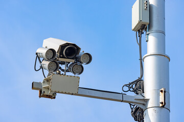 CCTV, Security road camera for traffic control on the street on blue sky	