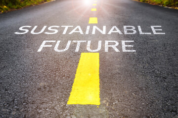 Sustainable future word on asphalt road surface with marking lines. Inspiration and motivation...