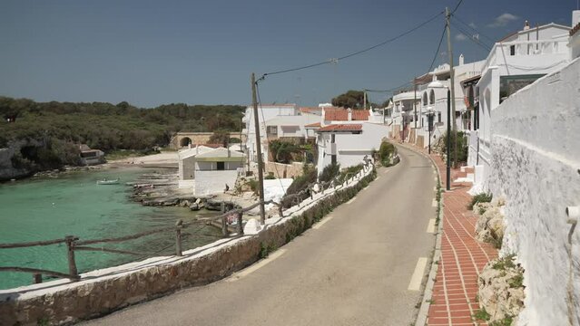 Turquoise water and whitewashed houses at Alcaufar, Menorca, Balearic Islands