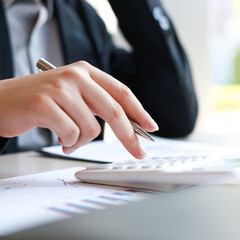 Fototapeta premium Accounting businessmen are calculating income-expenditure and analyzing real estate investment data, Dedicated to the progress and growth of the company, Financial and tax systems concept.