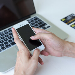 Men use smart phone to register online purchases using credit card payments, Convenience in the world of technology and the internet, Shopping online and banking online concept.