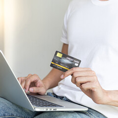Men use laptop to register online purchases using credit card payments, Convenience in the world of technology and the internet, Shopping online and banking online concept.
