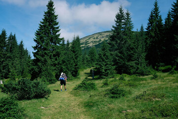 Fototapeta na wymiar A guy climbs a mountain in the Carpathians