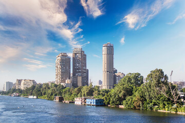 Beautiful view of the buildings on the waterfront of Zamalek Island in Cairo, Egypt - obrazy, fototapety, plakaty