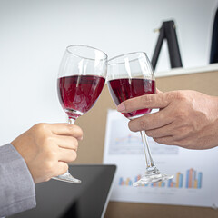 Both businessmen drink White to celebrate their financial and business success, Congratulate and celebrate concept.