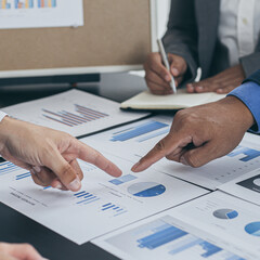 Business team meeting and presentation of works, Marketing department and data analysts propose ideas for driving sales strategies using graphs and charts, Brainstorming of business people.