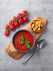 Tomato soup with basil in a bowl