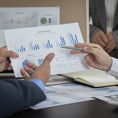 Business team meeting and presentation of works, Marketing department and data analysts propose ideas for driving sales strategies using graphs and charts, Brainstorming of business people.