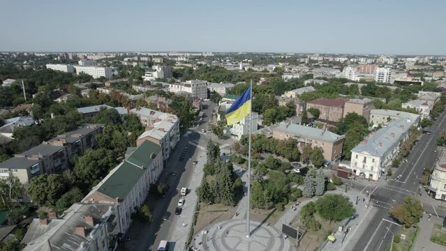 Poltava, Ukraine 23.08.22 Day of Ukraine flag. people on the square near the big Ukrainian flag