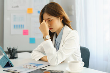 Successful business concept, Businesswoman feeling headache after working hard about new project