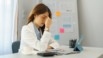 Successful business concept, Businesswoman feeling headache after working hard about new project