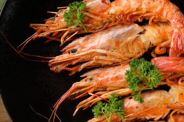 king prawns on a dark background of macro