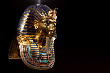 replica pharaoh egypt mask inside indoors dark closeup religion god golden exhibition