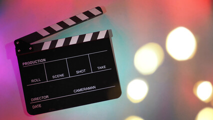 Black Clapperboard or movie clapper board or slate on neon pink ,purple,blue,Tiffany Blue ,mint green or multi color background..