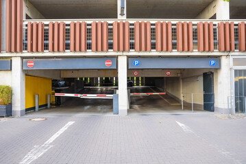 Entrance of a multi-storey car park in a city centre - obrazy, fototapety, plakaty