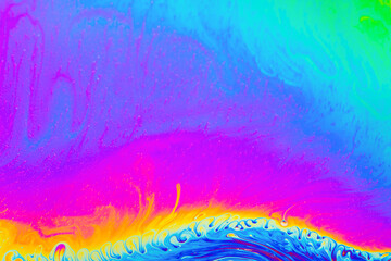 Psychedelic multicolored background abstract. Rainbow colors. patterns background. Photo macro shot of soap bubbles..