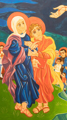Fototapeta na wymiar FORLÍ, ITALY - NOVEMBER 11, 2021: The modern fresco Virgin Mary and st. John under the cross among the saints in the church Chiesa di San Giuseppe Artigiano by Franco Vignazia (2019).