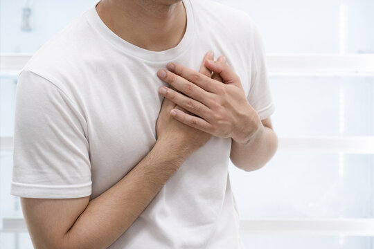 Man clutching his chest from acute pain.Heart attack symptom.