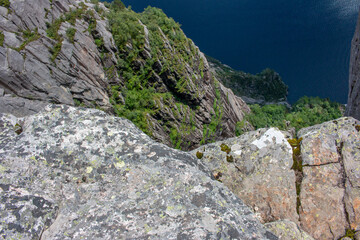 view down the Cliff, Rock Formations and Lysefjord landscape at Prekestolen (Preikestolen) in Rogaland in Norway (Norwegen, Norge or Noreg)