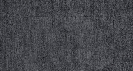 Fototapeta na wymiar close up of monochrome grey carpet texture background from above. texture tight weave carpet. the dark color background of the carpet.