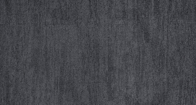 close up of monochrome grey carpet texture background from above. texture tight weave carpet. the dark color background of the carpet.