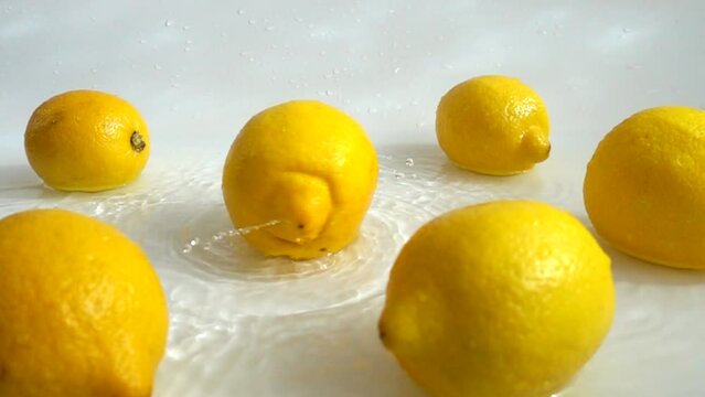 Washing of lemons water. Slow motion.