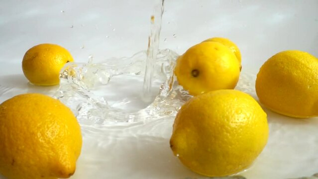Washing of lemons water. Slow motion.