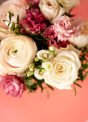Bright pink flowers bouquet closeup. Roses and orchids wallpaper. Beautiful background for a Birthday, International Female Day, or Saint Valentine. The festive backdrop for a postcard design