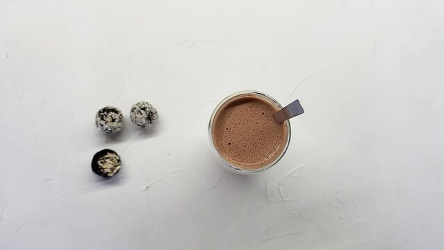 Cup of hot chocolate and three chocolates