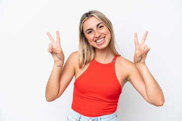 Fototapeta na wymiar Young caucasian woman isolated on white background showing victory sign with both hands