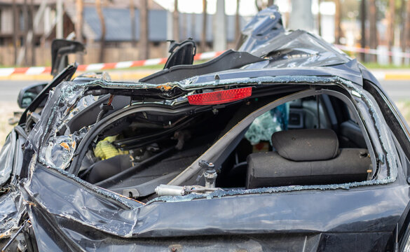 Shot car during the war in Ukraine. A car after an accident with a broken rear window. The wreckage of the interior of a modern car after an accident, a detailed close-up view of the damaged car.