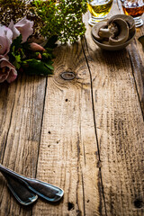 Pine boards with fresh vegetables, spices and cutlery 
