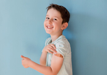 Vaccination concept. Boy on blue background