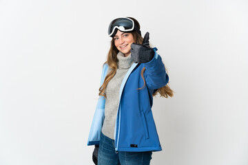 Skier girl with snowboarding glasses isolated on white background with thumbs up because something good has happened