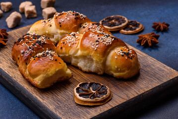 Delicious homemade pastries with apricot jam sprinkled with sesame seeds